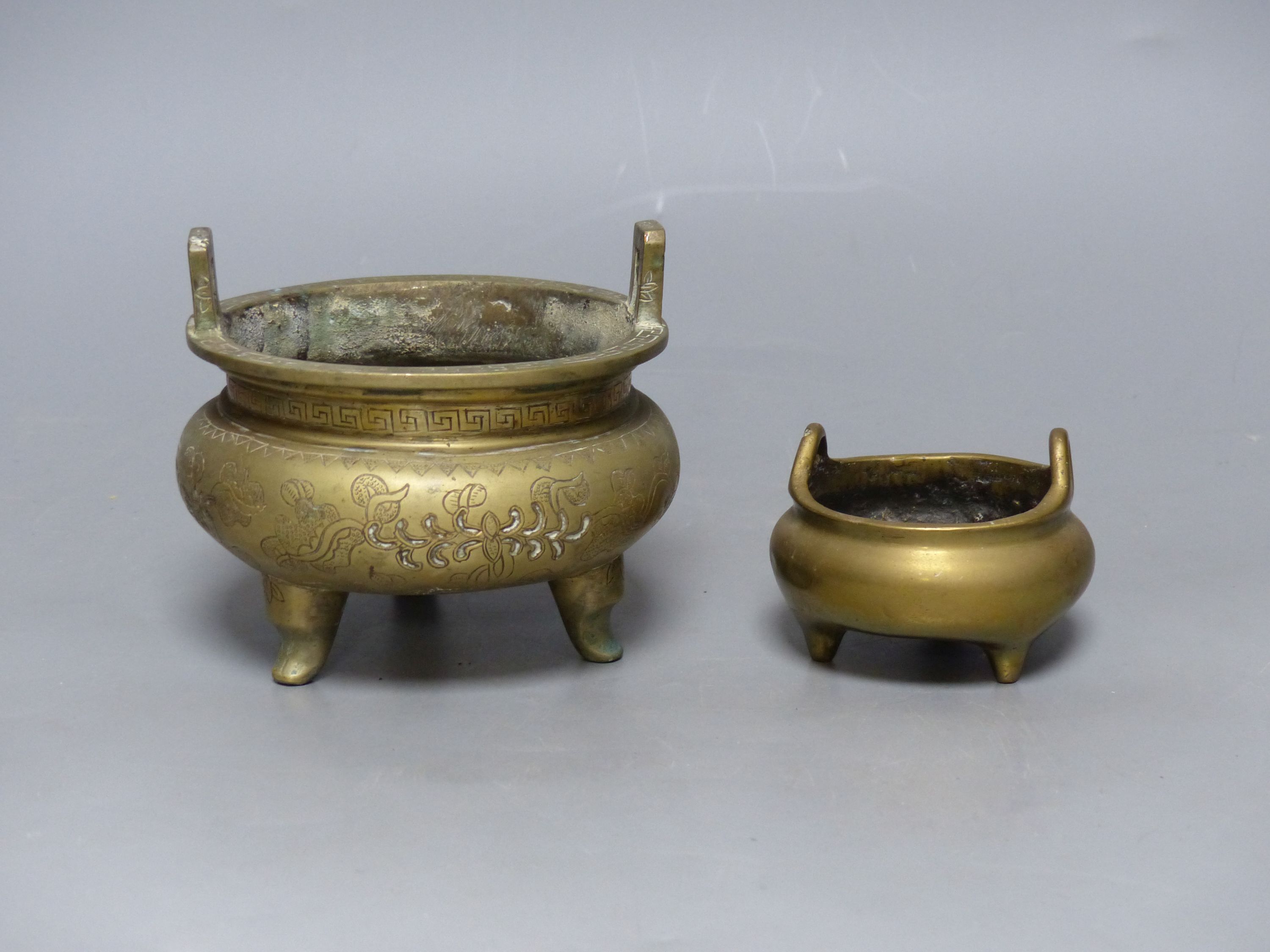 Two Chinese bronze tripod censers, Xuande marks, 19th/20th century, tallest overall 10cm